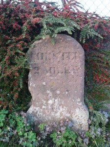 One of the original sandstone milestones on the former Mostyn House School driveway